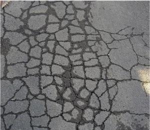 Rain washes away asphalt adhesive, leaving pesky crocodile cracks, a precursor to potholes.  Figure from http://en.wikipedia.org/wiki/File:Asphalt_deterioration.jpg